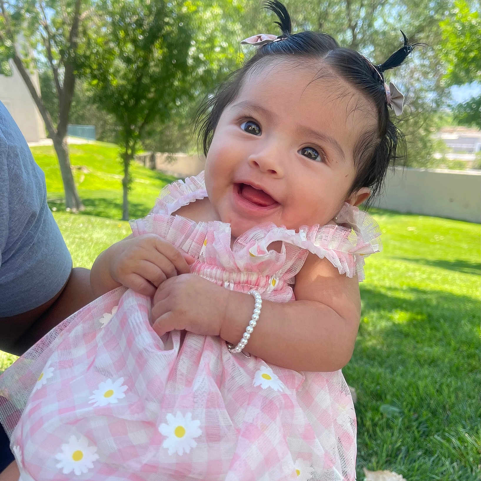 Liliana is registered to the contest to win money with this photo: accessories, baby, backyard, clothing, dress, face, grass, head, jewelry, lawn, nature, necklace, outdoors, park, person, photography, plant, portrait, tree, yard