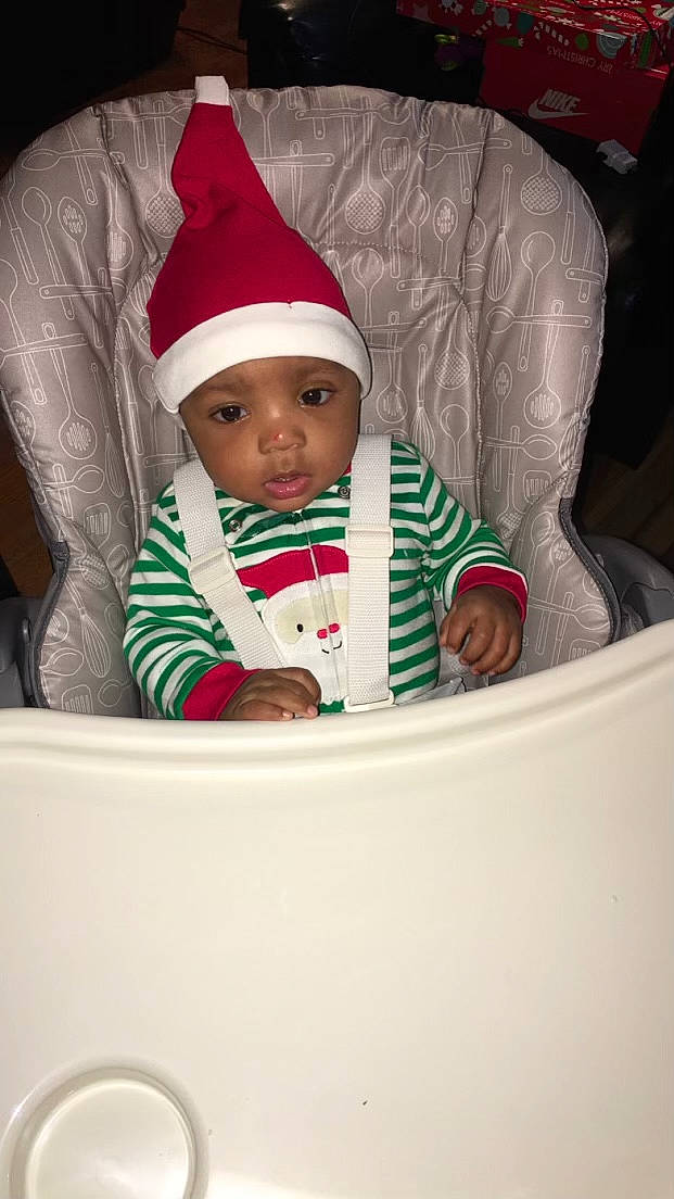 Kennan joined the competition — help win amazing prizes! baby, baby_toddler_clothing, cap, carmine, child, christmas, christmas_eve, comfort, costume_hat, event, fictional_character, happy, headgear, headwear, holiday, lap, person, product, santa_claus, sitting
