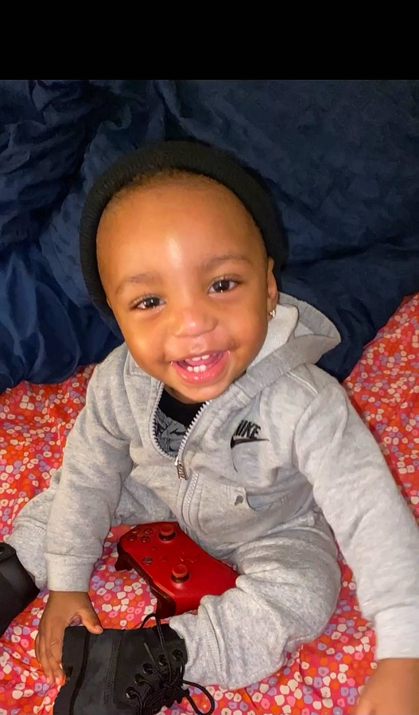 Kennan is registered to the contest to win money with this photo: baby, baby_toddler_clothing, beauty, cheek, child, comfort, eye, face, finger, flash_photography, fun, happy, head, iris, joy, mouth, nose, person, skin, sleeve