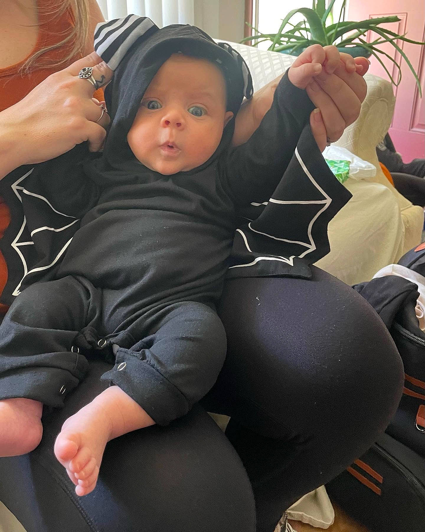 Ares is registered to the contest to win money with this photo: baby_carriage, car_seat, chair, comfort, eyewear, flowerpot, headwear, houseplant, human_body, human_leg, joint, knee, lap, leg, leisure, person, personal_protective_equipment, plant, spandex, steering_wheel