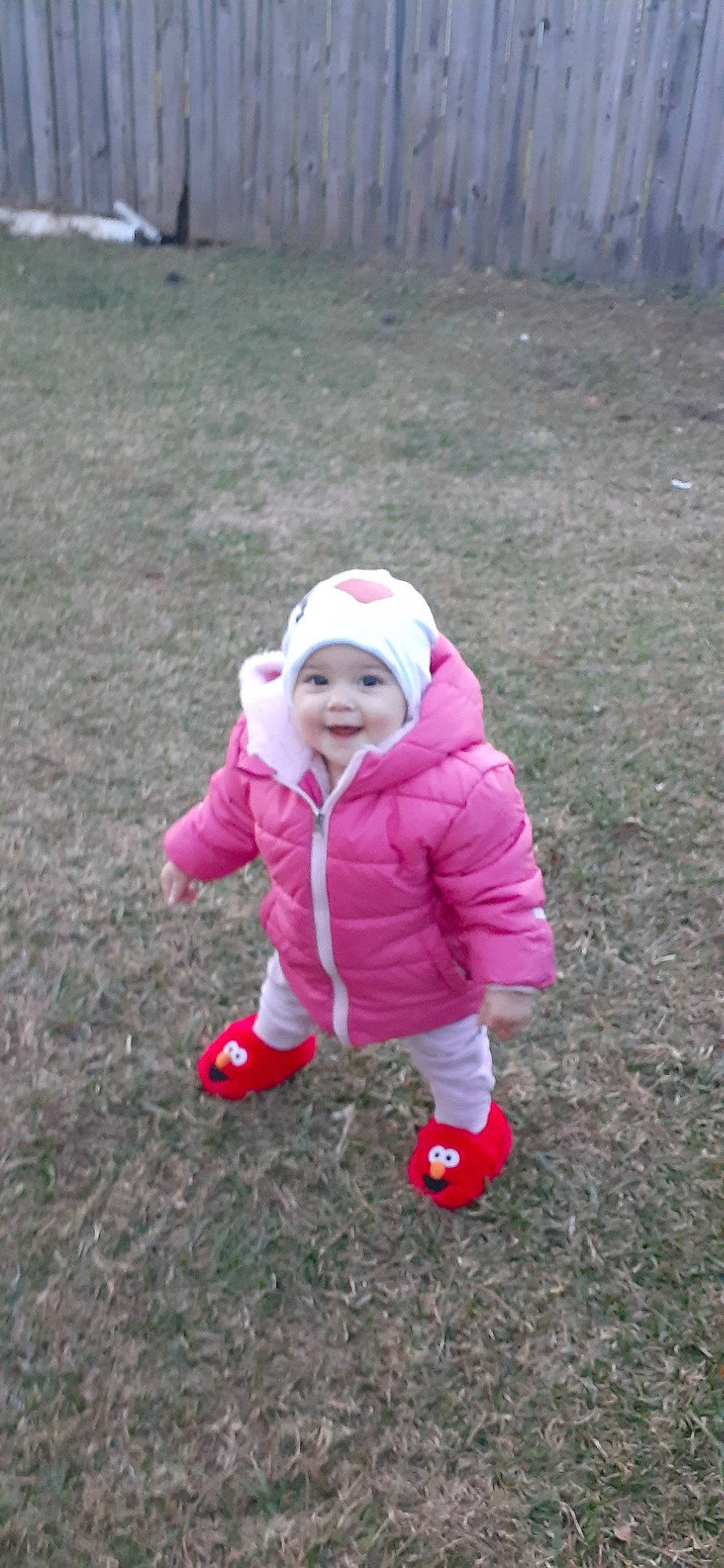 Olivia May Grinstead joined the competition — help win amazing prizes! baby_toddler_clothing, cap, face, fun, grass, grassland, happy, hat, headwear, jacket, joy, leisure, magenta, people_in_nature, person, plant, recreation, sleeve, smile, soil