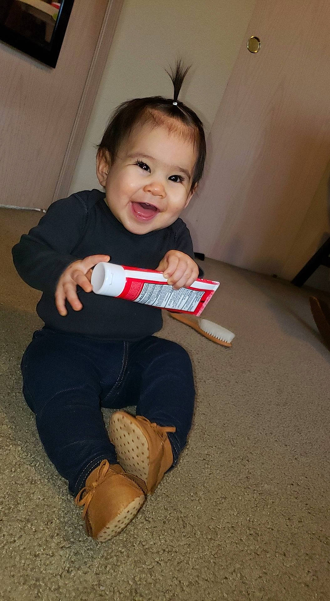 Lola joined the competition — help win amazing prizes! arm, baby, baby_toddler_clothing, cheek, chin, comfort, finger, flash_photography, floor, flooring, fun, happy, head, joy, person, sitting, skin, sleeve, smile, sock