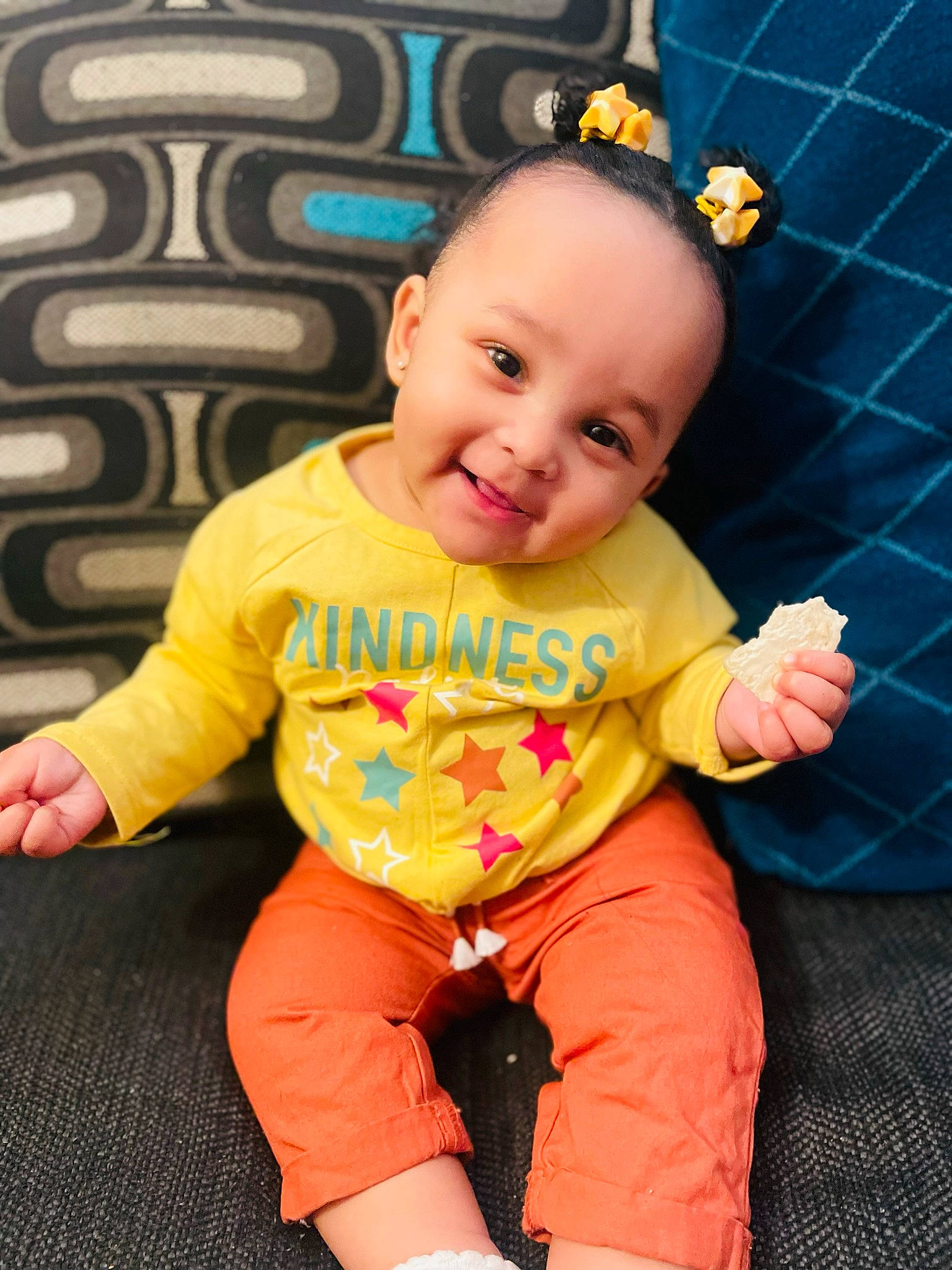 Reign joined the competition — help win amazing prizes! baby, baby_products, baby_toddler_clothing, chair, cheek, child, chin, cool, face, finger, fun, happy, joy, orange, person, pink, skin, sleeve, smile, standing