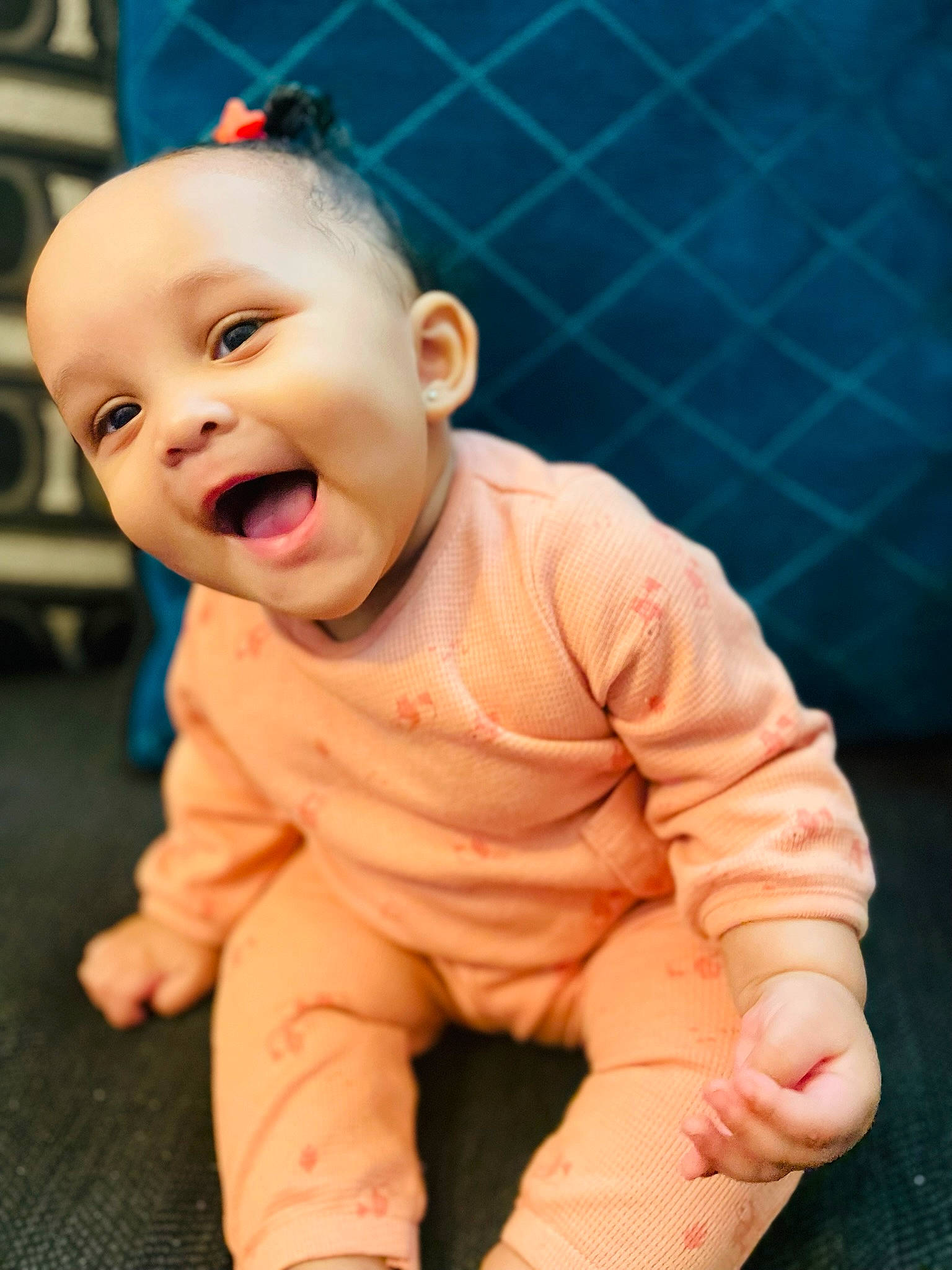 Reign joined the competition — help win amazing prizes! baby, baby_laughing, baby_toddler_clothing, cheek, chin, face, flooring, foot, fun, happy, human_body, lip, mouth, nose, person, sitting, skin, sleeve, smile, thumb