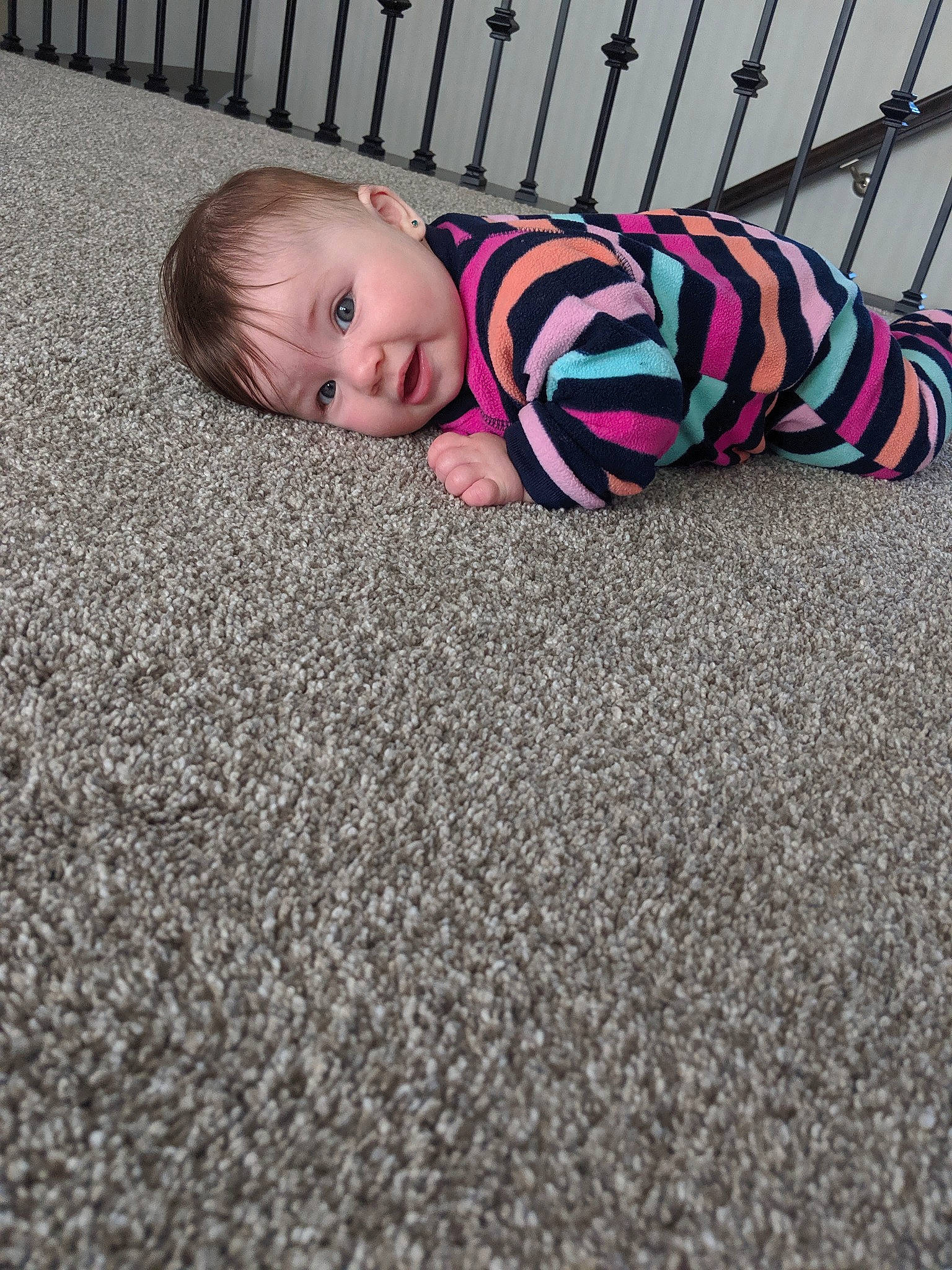 Jupiter is registered to the contest to win money with this photo: baby, carpet, child, crawling, floor, flooring, pattern, person, pink, play, toddler