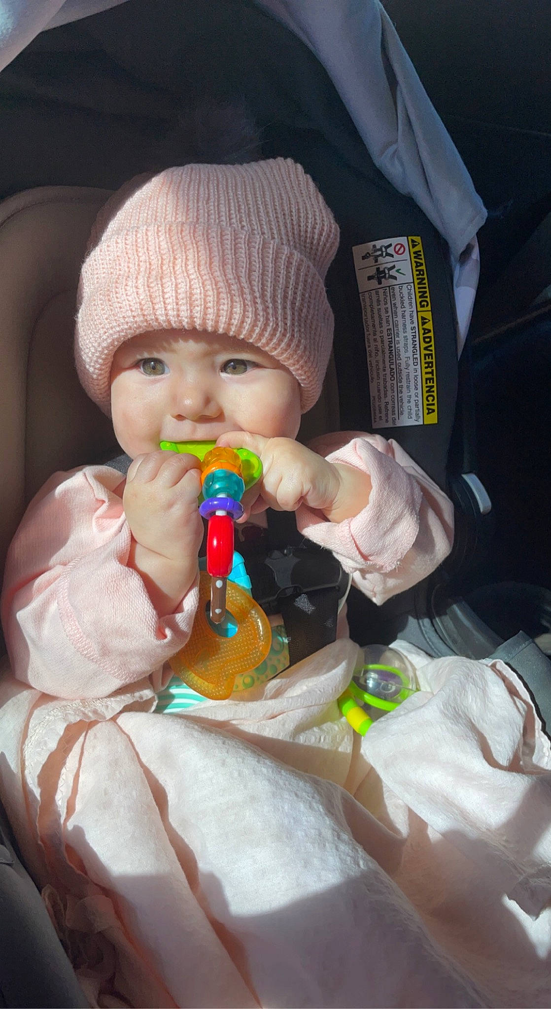 Scarlette is registered to the contest to win money with this photo: baby, baby_products, baby_toddler_clothing, bottle, cap, car_seat, cheek, comfort, drinkware, eye, eyelash, finger, hand, headgear, headwear, lip, mouth, nose, person, plastic_bottle
