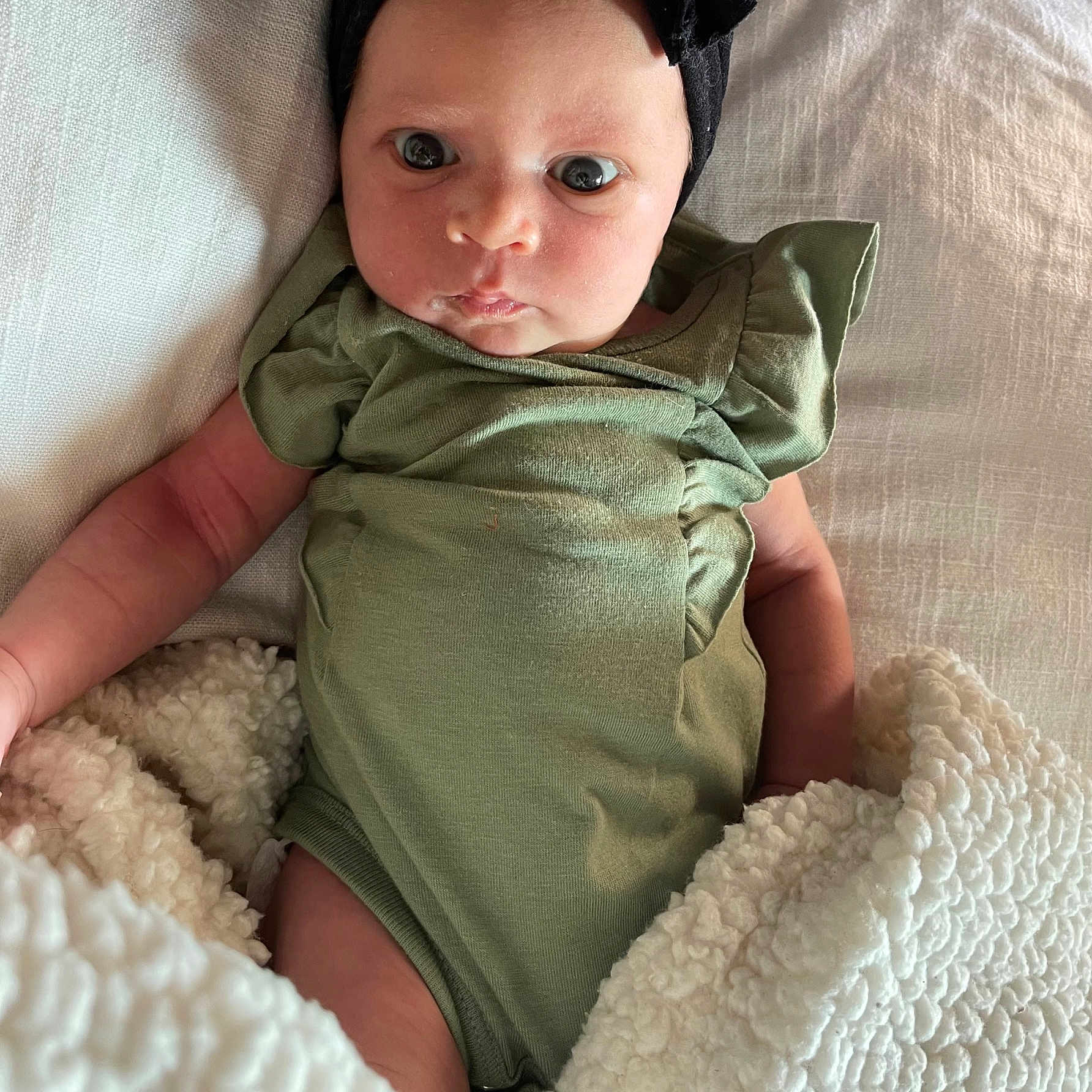 Val is registered to the contest to win money with this photo: baby, baby_toddler_clothing, clothing, comfort, costume_hat, eye, eyelash, face, fedora, hand, hat, head, iris, lip, organ, skin, sleeve, sun_hat, textile, toddler