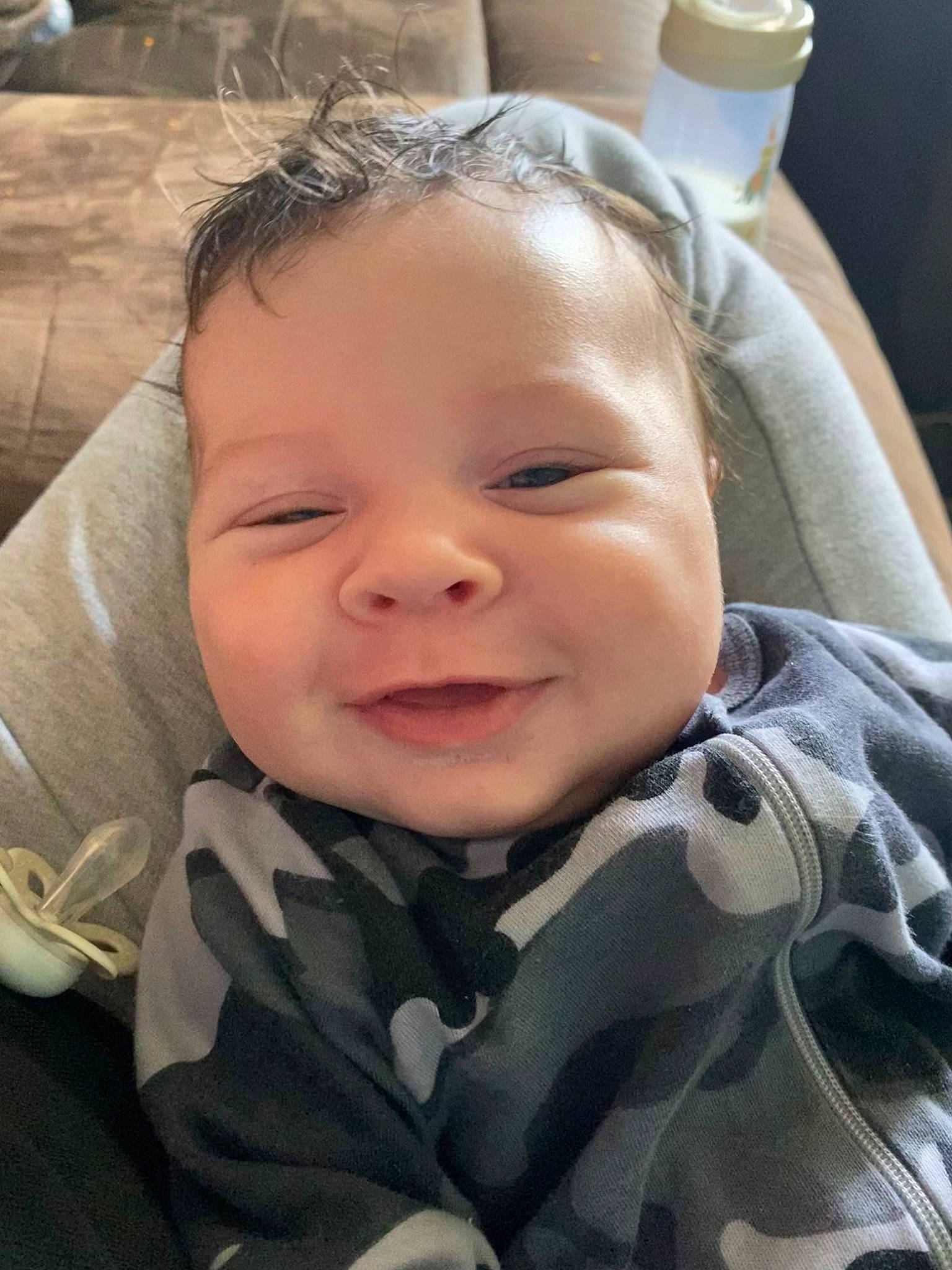 Malakai is registered to the contest to win money with this photo: baby, baby_toddler_clothing, cheek, child, comfort, eye, eyelash, face, fun, happy, iris, joy, lip, mouth, nose, person, plant, skin, sleeve, smile