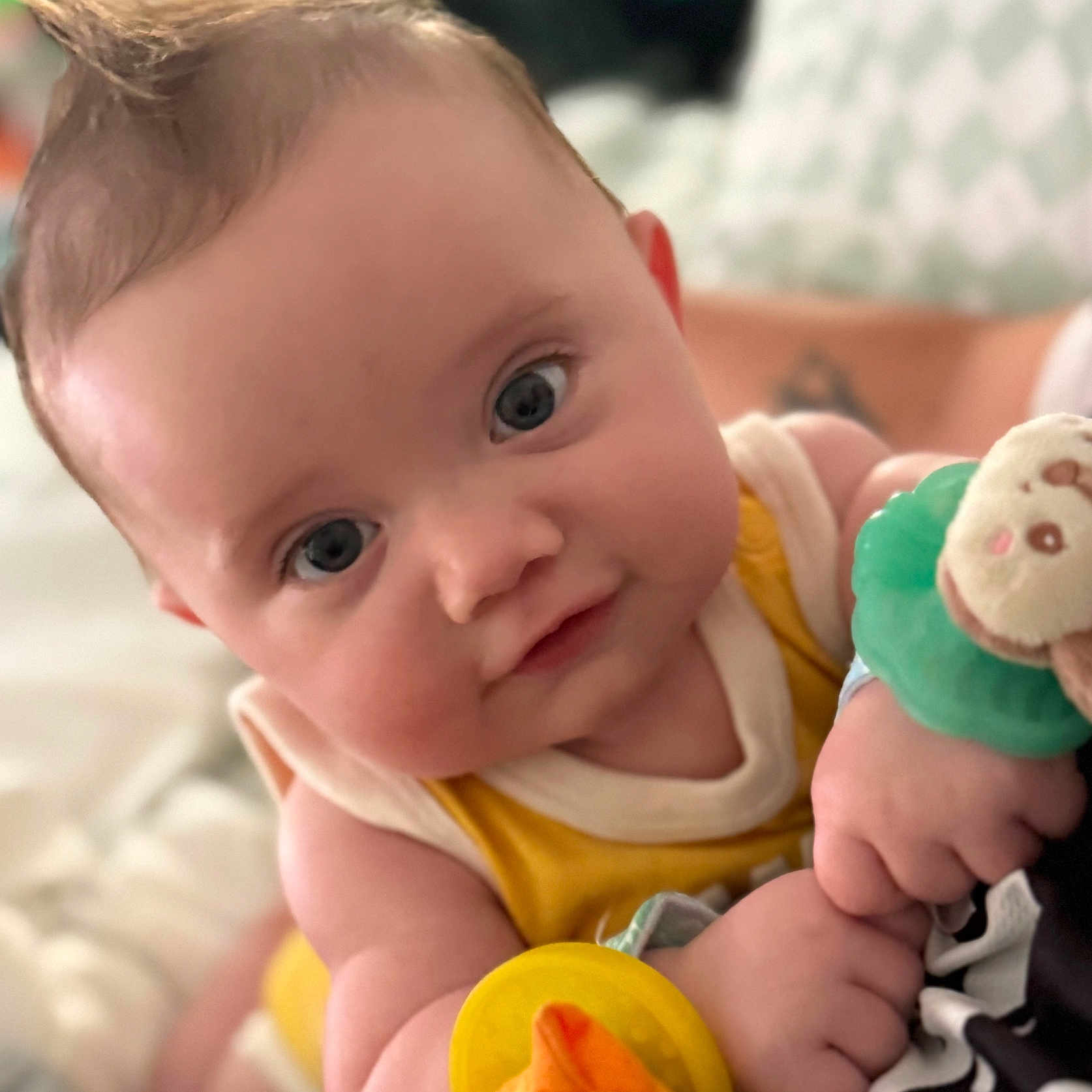 Osiris joined the competition — help win amazing prizes! baby, child, clothing, cozy, cute, eyes, face, hair, hand, holding, indoors, infant, person, plush_toy, portrait, skin, smile, soft_focus, toy, yellow