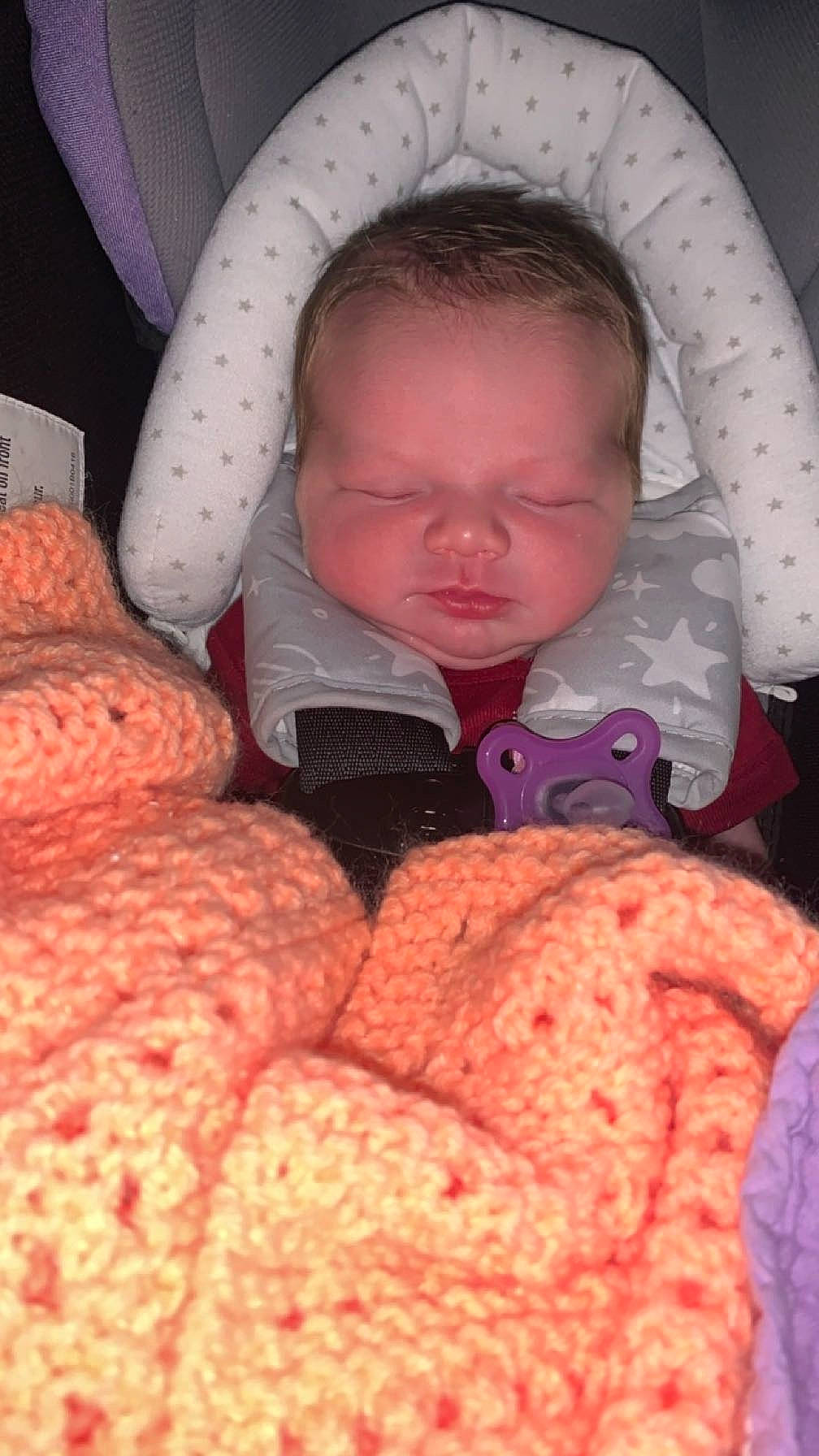 Mariana is registered to the contest to win money with this photo: baby, baby_sleeping, baby_toddler_clothing, cheek, comfort, finger, hand, human_body, linens, mouth, nose, organ, outerwear, person, pink, product, skin, textile, thumb, toddler