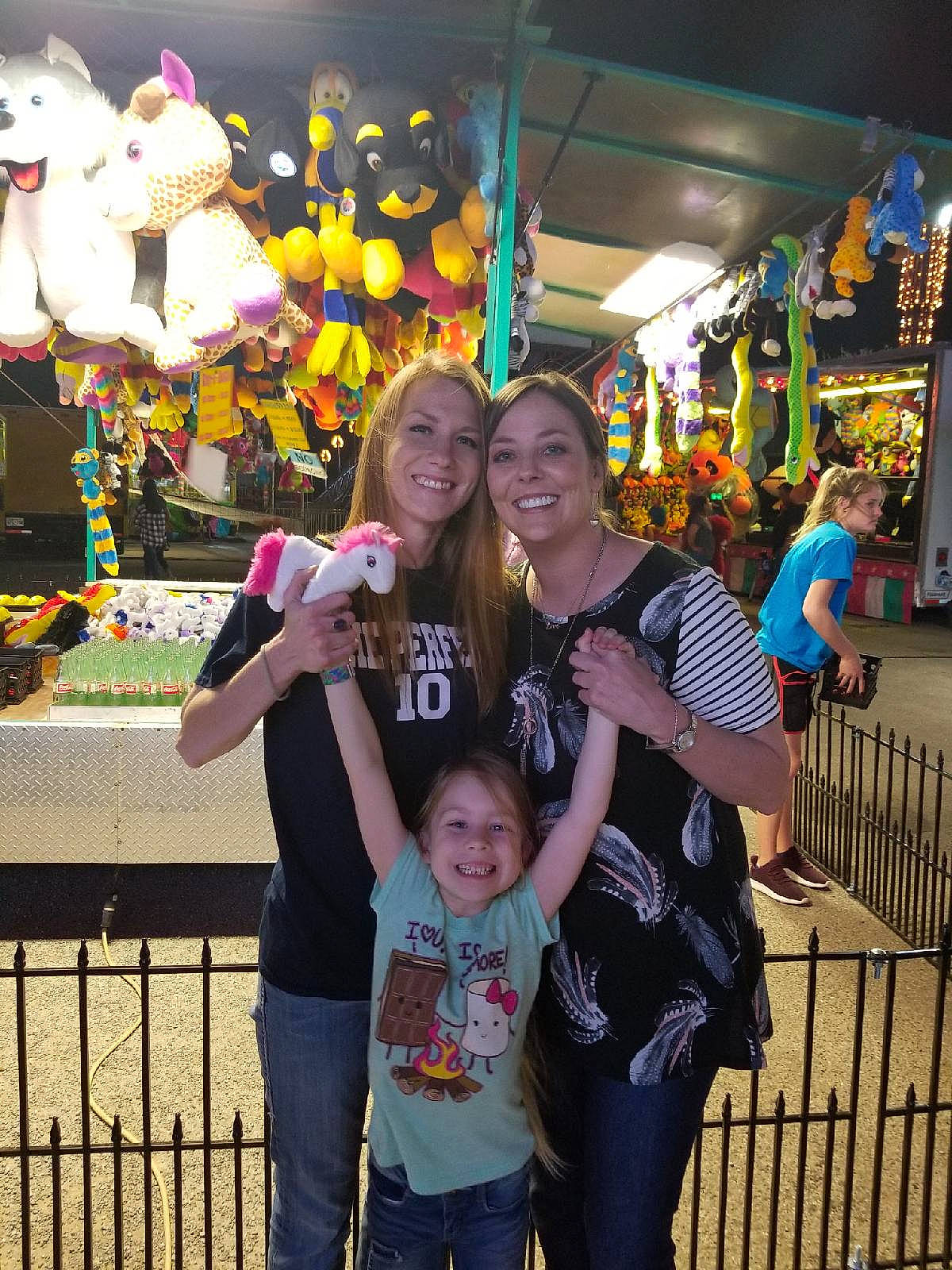 Emma-kate is registered to the contest to win money with this photo: black, child, city, event, fence, fun, happy, joy, leisure, people, person, photograph, recreation, shorts, smile, snapshot, social_group, t_shirt, temple, toddler