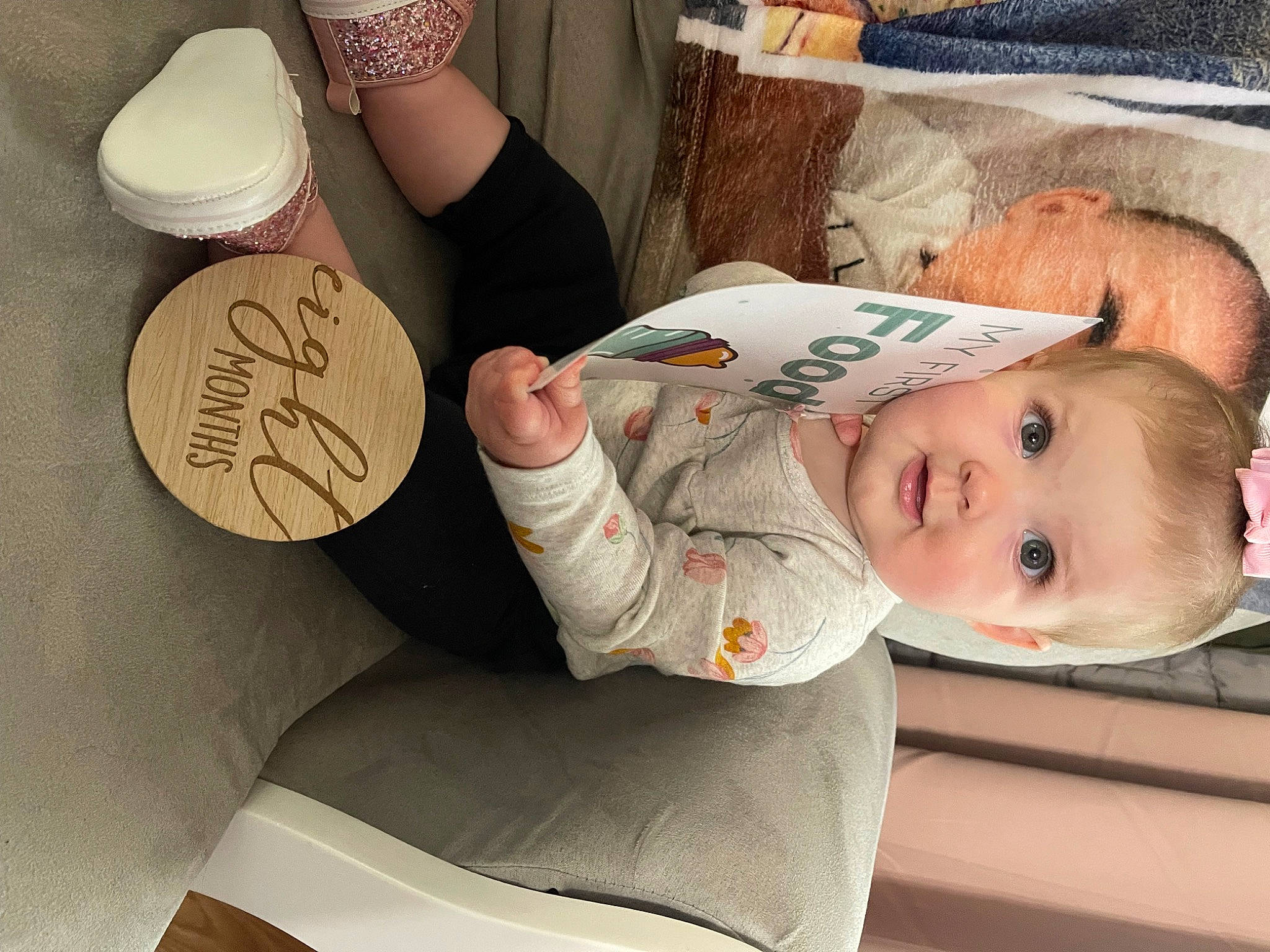 Laila is registered to the contest to win money with this photo: baby, baby_toddler_clothing, child, clothing, comfort, finger, gesture, hairstyle, hand, headgear, human_body, human_leg, mammal, nail, person, product, skin, sleeve, smile, thigh