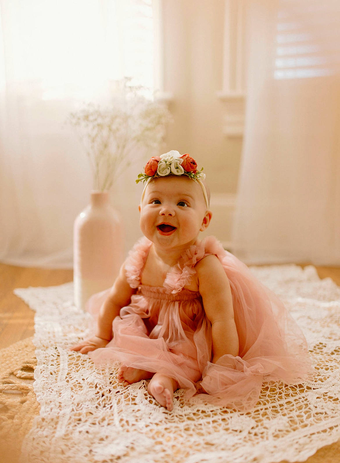 Lola is registered to the contest to win money with this photo: baby, bathing, bridal_accessory, dress, embellishment, fashion_accessory, flash_photography, flooring, fur, happy, headband, headpiece, jewellery, necklace, peach, person, sitting, smile, toddler, toy