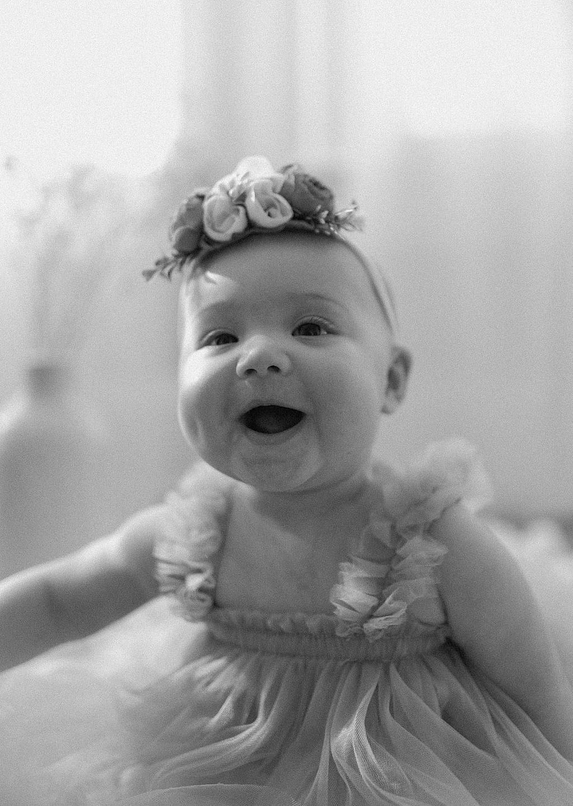 Lola is registered to the contest to win money with this photo: art, baby, child, fashion_accessory, flash_photography, fun, gesture, hair_accessory, happy, hat, headpiece, human_body, iris, monochrome, monochrome_photography, person, petal, smile, stock_photography, toddler
