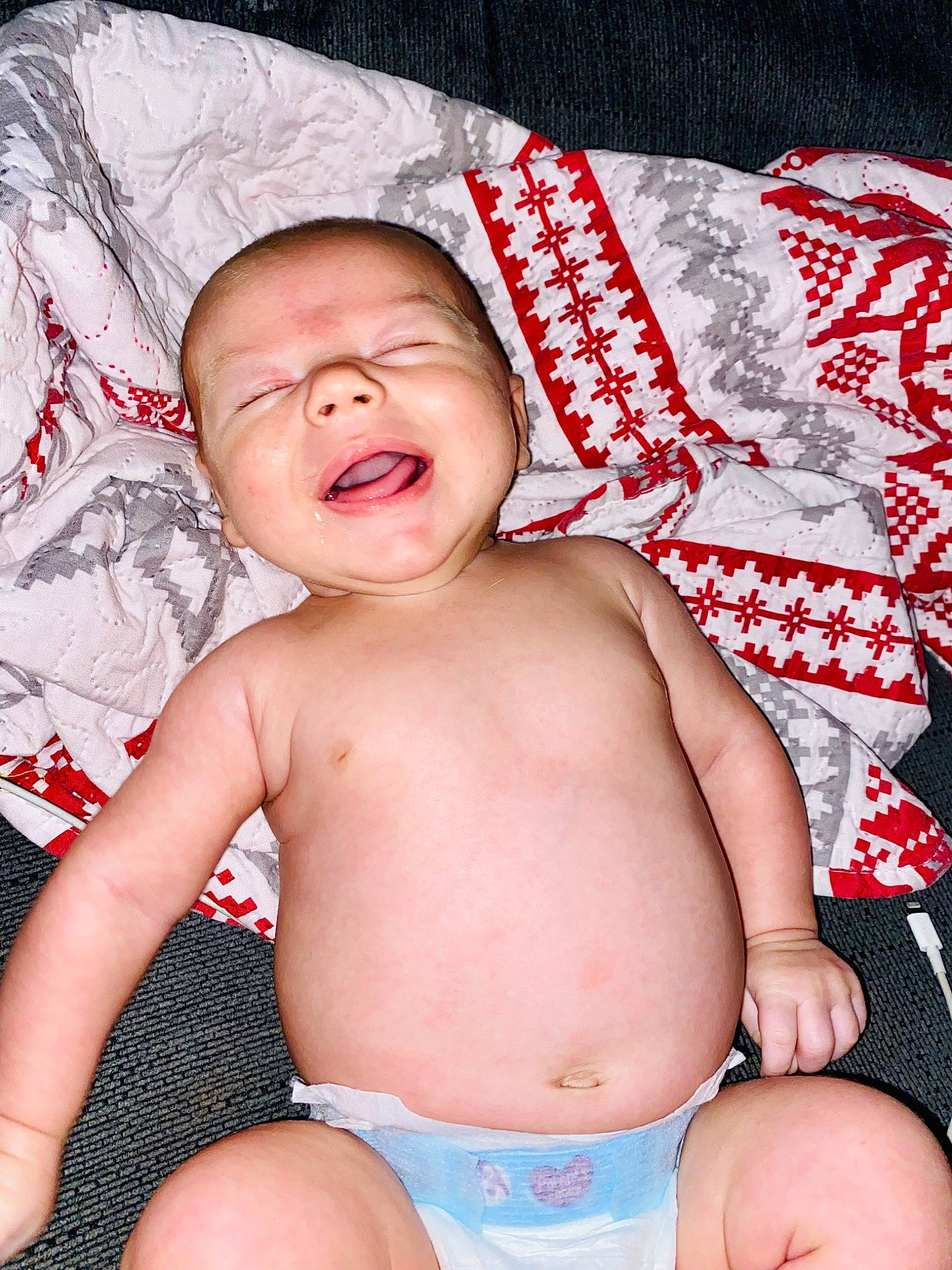 Cash is registered to the contest to win money with this photo: baby, cheek, chest, eye, facial_expression, finger, happy, human_body, mouth, muscle, neck, organ, person, red, skin, stomach, textile, thigh, thumb, toddler