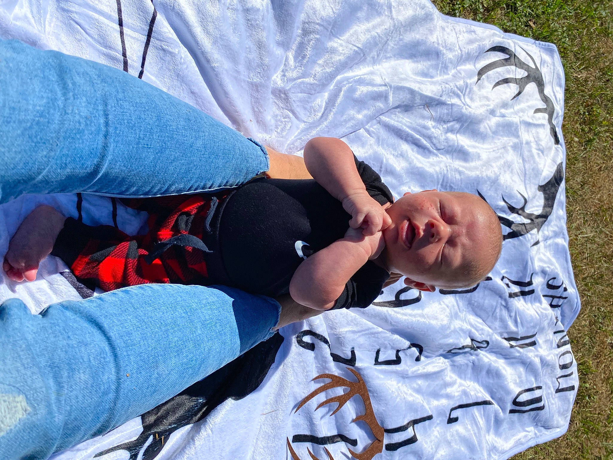 Cash is registered to the contest to win money with this photo: child, comfort, elbow, electric_blue, fun, grass, happy, lap, leisure, linens, nap, pattern, person, sitting, sleep, sleeve, t_shirt, textile