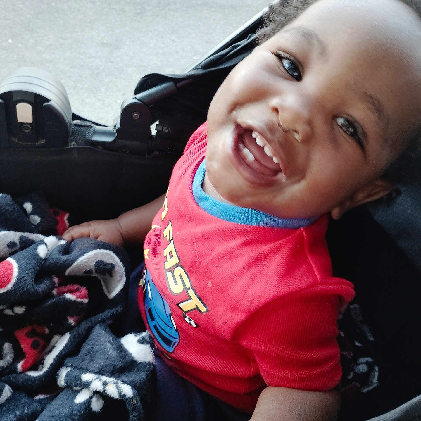 Lavar Jr joined the competition — help win amazing prizes! toddler, child, smiling, happy, blanket, red_shirt, stroller, outdoor, portrait, baby, cute, face, person, clothing, seat, joy, expression, daylight, casual, fun