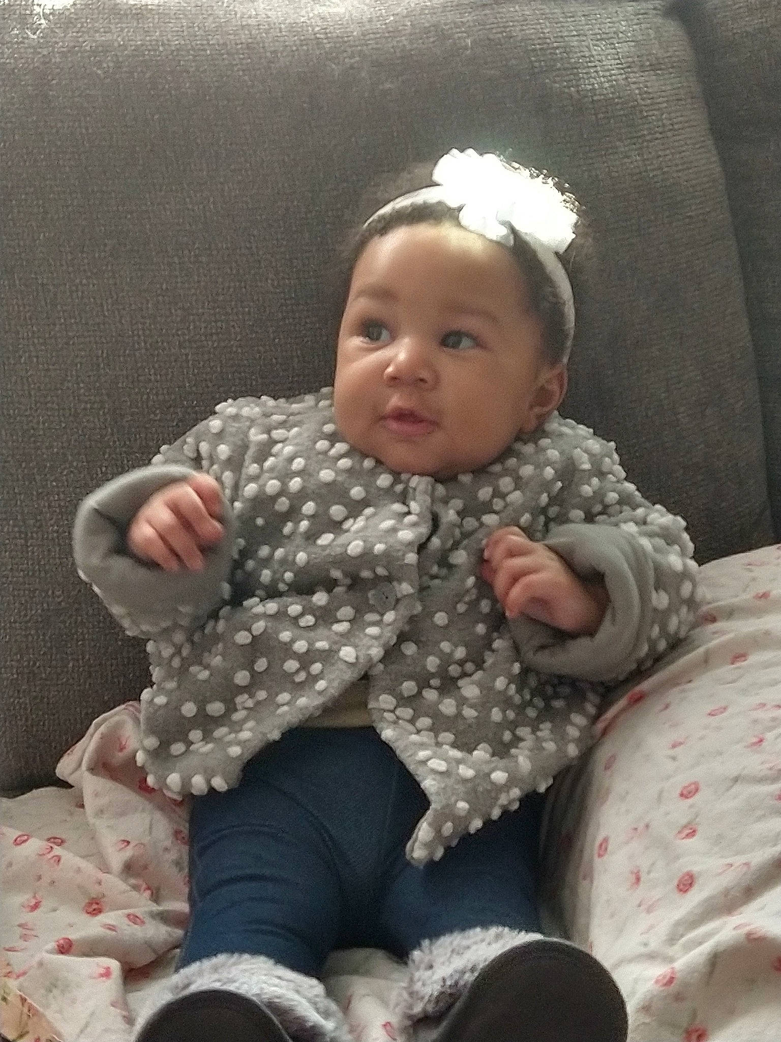 Novah is registered to the contest to win money with this photo: baby, baby_toddler_clothing, chair, cheek, child, comfort, eye, face, facial_expression, hairstyle, head, lap, pattern, person, sitting, skin, sleeve, sock, standing, toddler