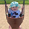 Liam joined the competition — help win amazing prizes! baby, casual, chains, child, clothing, daylight, feet, fun, grass, happy, hat, outdoor, park, person, playground, sand, smile, sunny, swing, toddler
