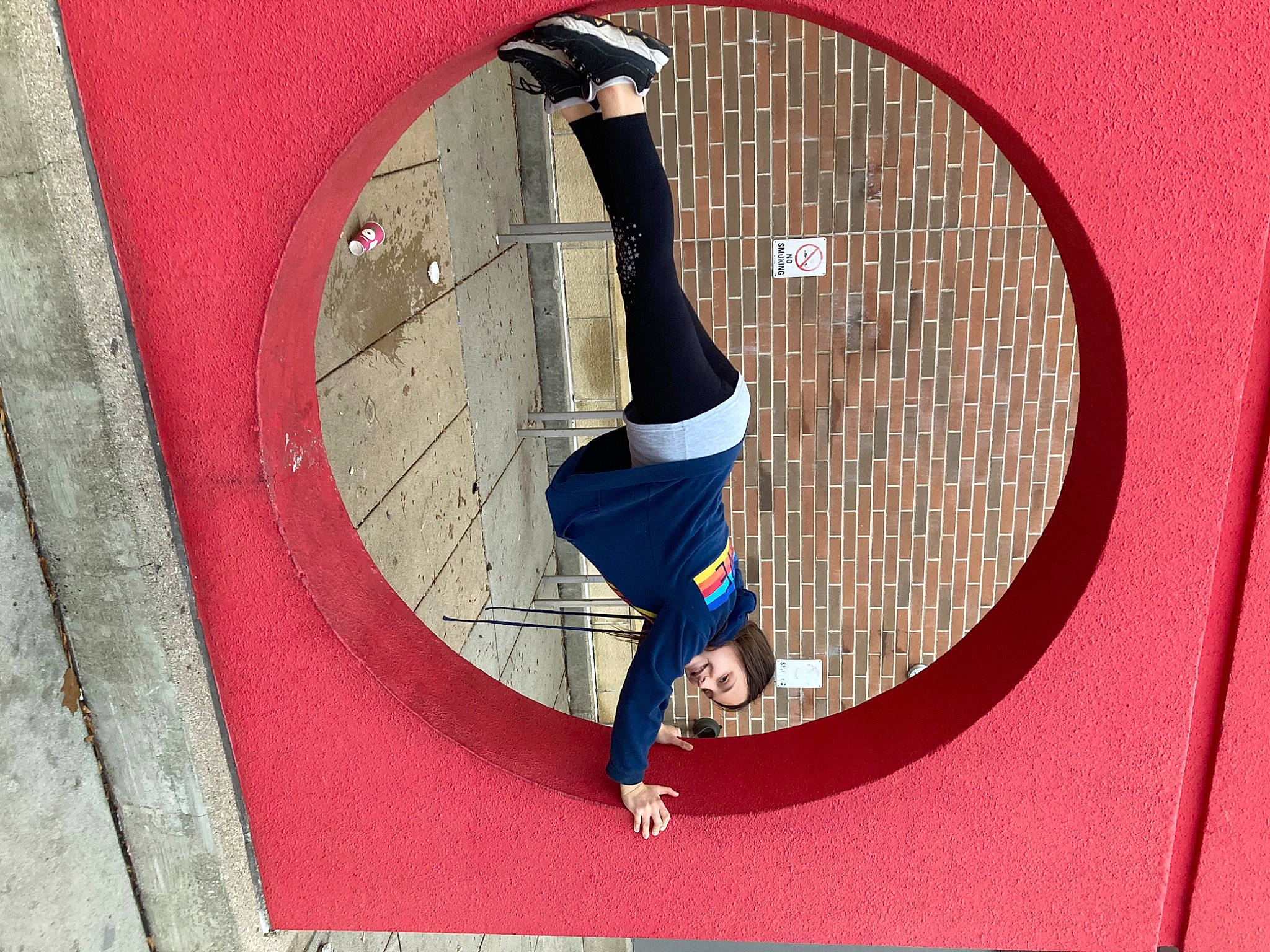 Bella is registered to the contest to win money with this photo: acrobatics, balance, carmine, circle, elbow, electric_blue, entertainment, event, font, graphics, human_leg, joy, knee, magenta, pattern, performing_arts, person, recreation, sportswear, thigh