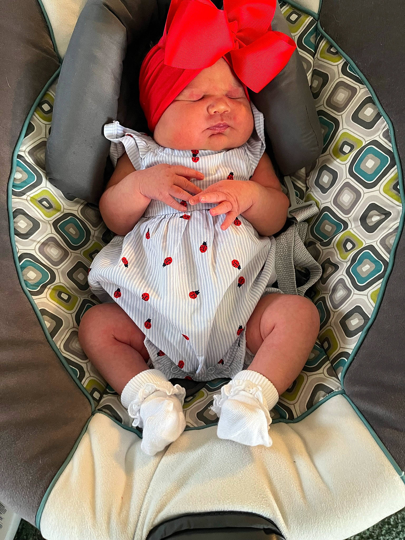 Addison joined the competition — help win amazing prizes! arm, baby, baby_products, baby_sleeping, baby_toddler_clothing, car_seat, carmine, child, comfort, headwear, human_body, human_leg, lap, linens, pattern, person, sitting, sleeve, sock, textile