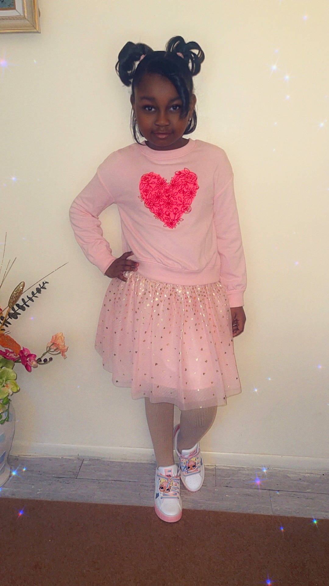 Aliyah is registered to the contest to win money with this photo: blouse, child, clothing, dress, face, female, flower, flowerarrangement, footwear, girl, head, longsleeve, person, photography, plant, portrait, pottedplant, shoe, skirt, sleeve