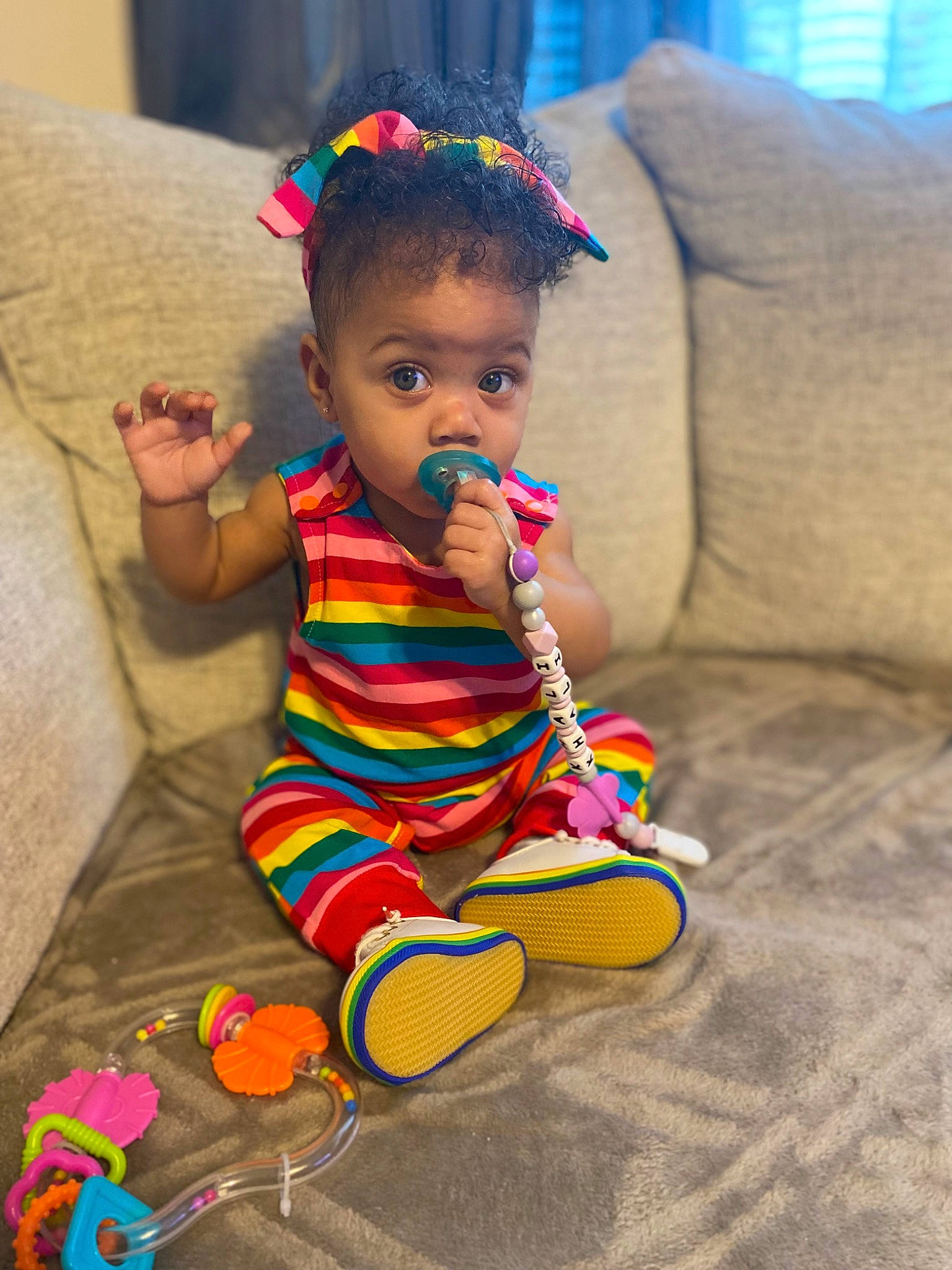 Khali joined the competition — help win amazing prizes! baby, baby_toddler_clothing, child, clothing, couch, dress, facial_expression, flooring, fun, happy, head, human_leg, magenta, pattern, person, play, room, sitting, skin, surprise
