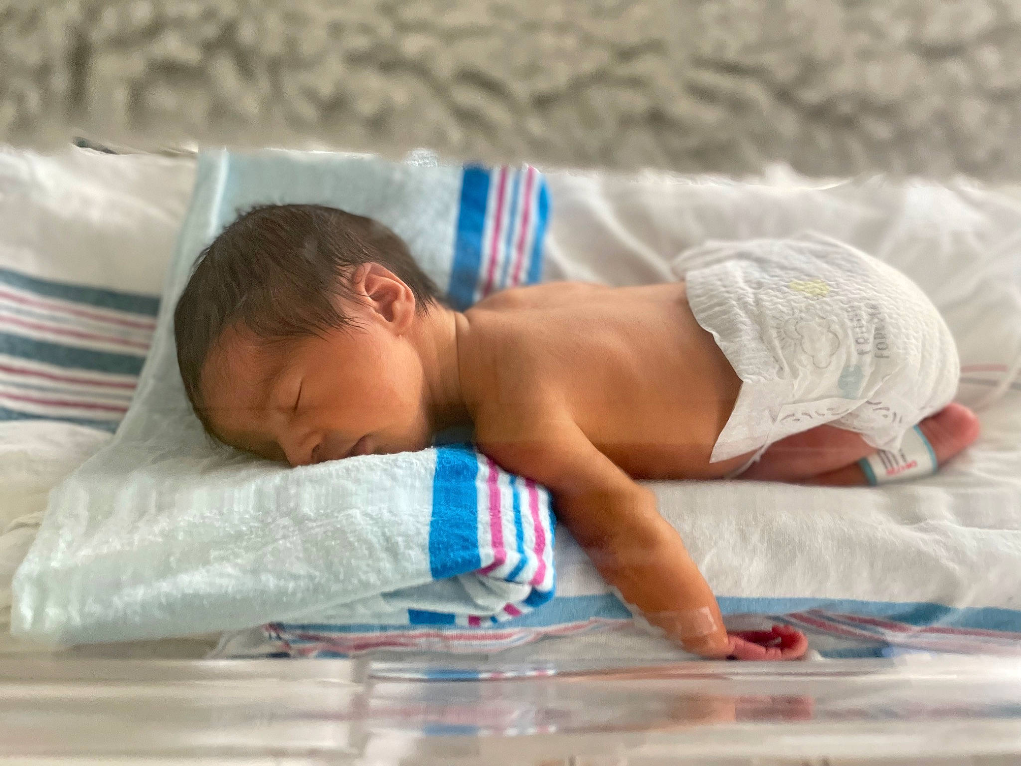 Khalid joined the competition — help win amazing prizes! abdomen, baby, barechested, barefoot, bedding, chest, child, comfort, foot, hair, headgear, human_body, human_leg, leisure, linens, muscle, person, swimwear, thigh, toddler