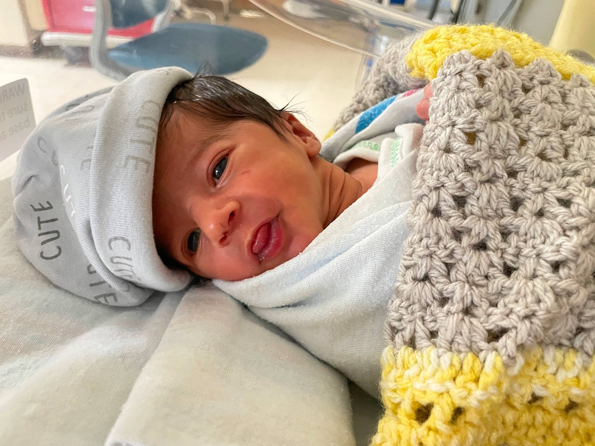 Khalid is registered to the contest to win money with this photo: baby, bedding, child, comfort, craft, fur, happy, hospital, linens, mammal, nap, needlework, pattern, person, room, smile, thread, toddler, wool, woolen