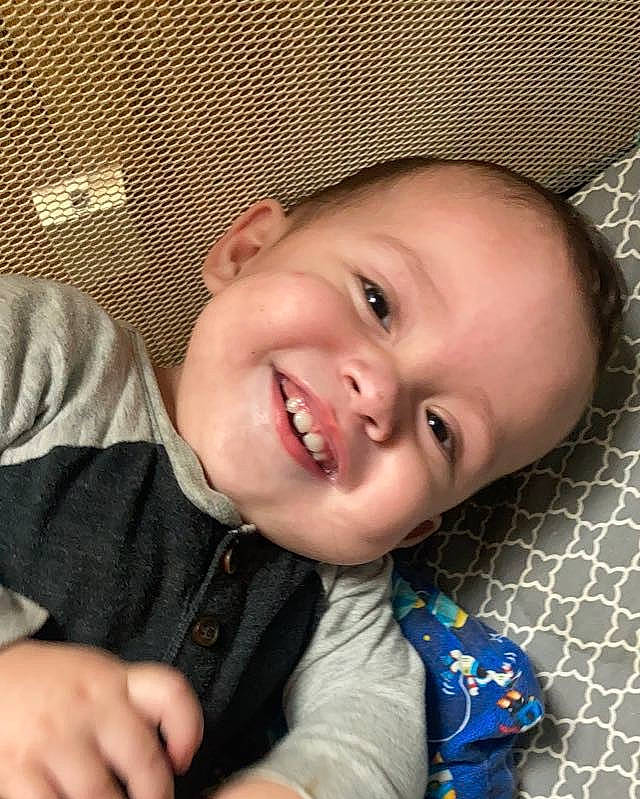 Jaime is registered to the contest to win money with this photo: baby, cheek, chin, eye, eyebrow, face, finger, gesture, hairstyle, happy, head, iris, joy, lip, mouth, nose, person, skin, sleeve, smile