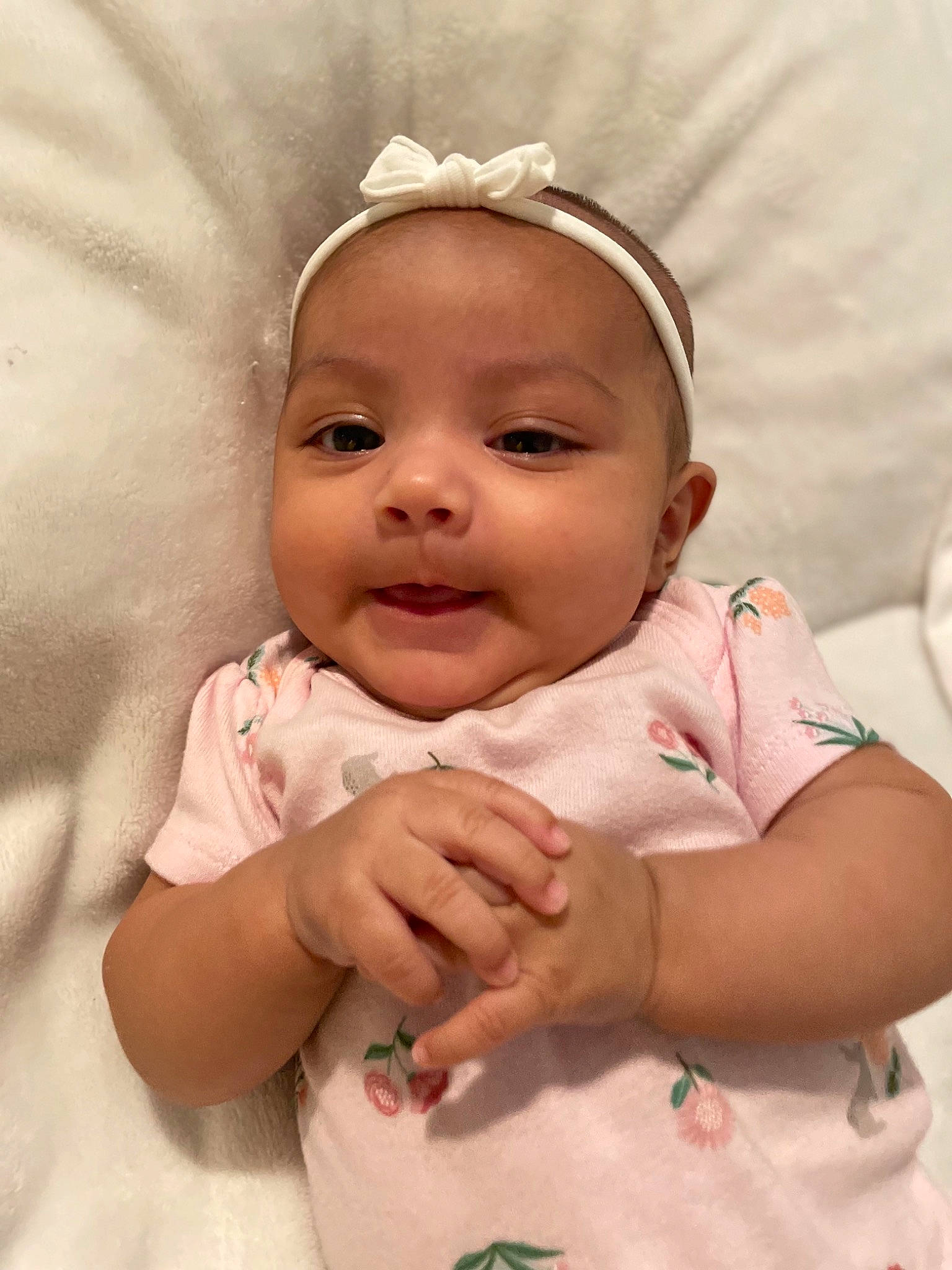 Esme joined the competition — help win amazing prizes! baby, baby_toddler_clothing, cheek, comfort, eye, eyebrow, eyelash, finger, gesture, hand, happy, head, iris, lip, nose, person, pink, skin, sleeve, smile