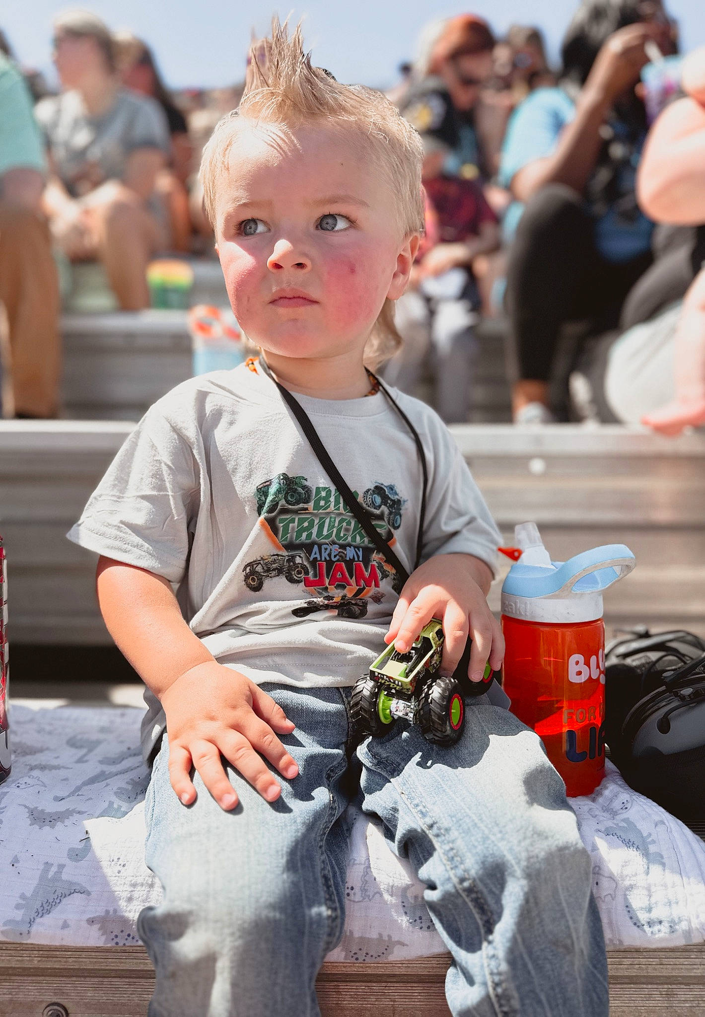 Jackson joined the competition — help win amazing prizes! baby, child, drink, event, fun, grass, happy, leisure, person, recreation, sitting, t_shirt, toddler, tourism, toy, toy_vehicle, vacation, wheel