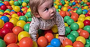 Emy a rejoint le concours — aidez-le/la à gagner de superbes lots ! active, adult, ball_pit, bright_colors, casual_clothing, child, colorful_balls, crawling, curly_hair, family, fun, happy, indoor_play_area, leisure, person, play, playground, recreation, toddler, young_child