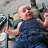 Gage is registered to the contest to win money with this photo: baby, denim_overalls, mechanics_creeper, tools, wrench, wd40, garage, concrete_floor, smiling, milestone, wooden_plaque, infant, cute, happy, face, person, clothing, metal_tools, workshop, baby_milestone