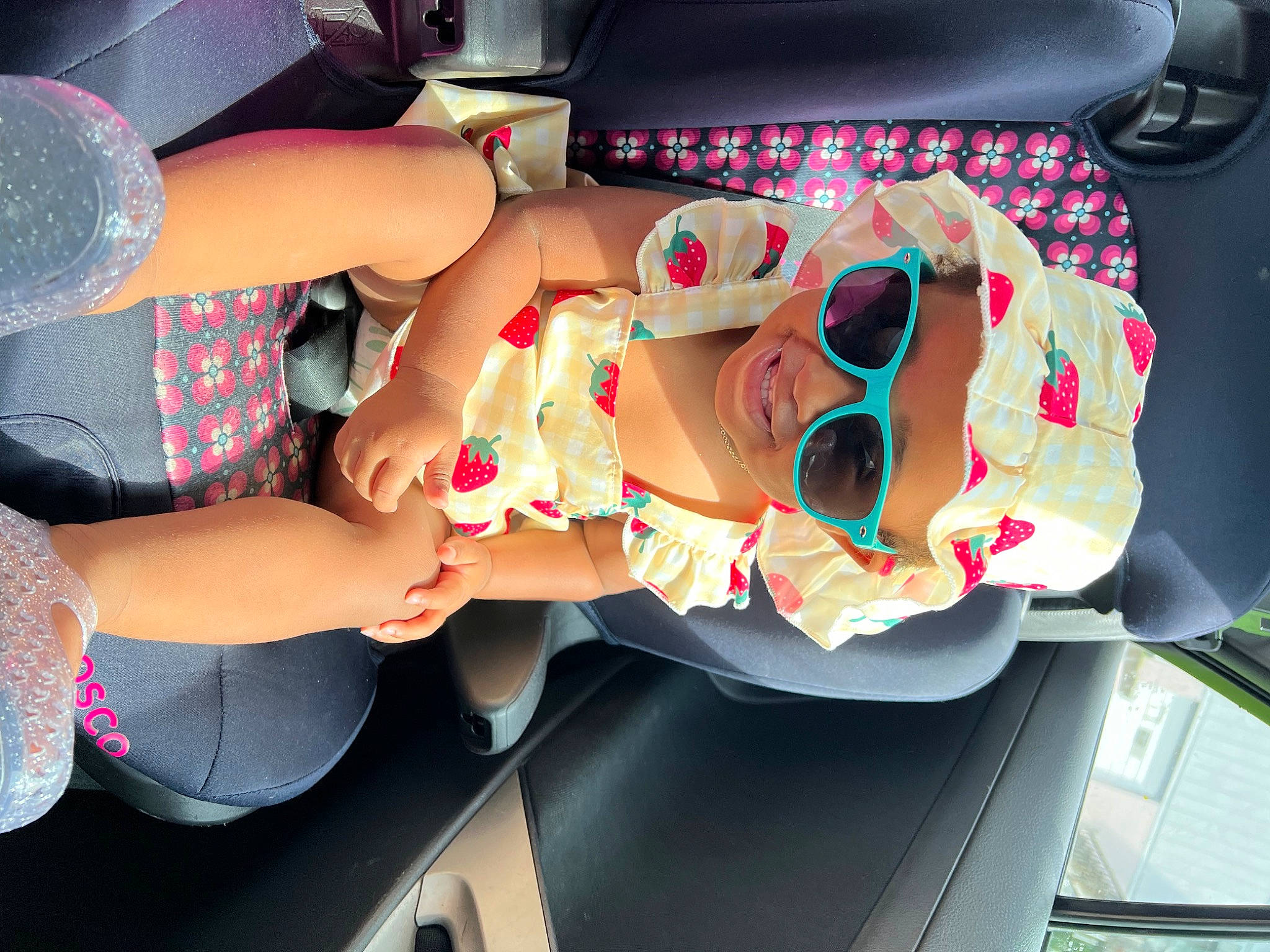 Ameri is registered to the contest to win money with this photo: auto_part, automotive_design, automotive_exterior, car, car_seat, eyewear, fun, goggles, hat, motor_vehicle, mouth, person, personal_protective_equipment, pink, smile, sunglasses, thigh, toy, trunk, vehicle_door