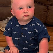 Jace joined the competition — help win amazing prizes! baby, casual, child, chubby_cheeks, couch, cute, expression, feet, hands, home, indoor, infant, navy_blue_clothing, play_mat, portrait, shark_pattern, sitting, sneaker, toys, wooden_floor