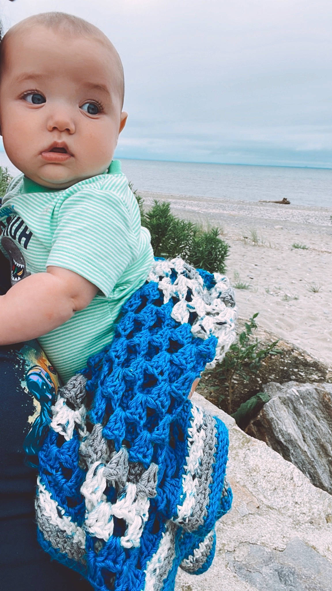 Connor is registered to the contest to win money with this photo: azure, baby, baby_toddler_clothing, beach, beauty, blue, child, electric_blue, fun, grass, happy, horizon, pattern, person, sky, sleeve, textile, toddler, travel, water