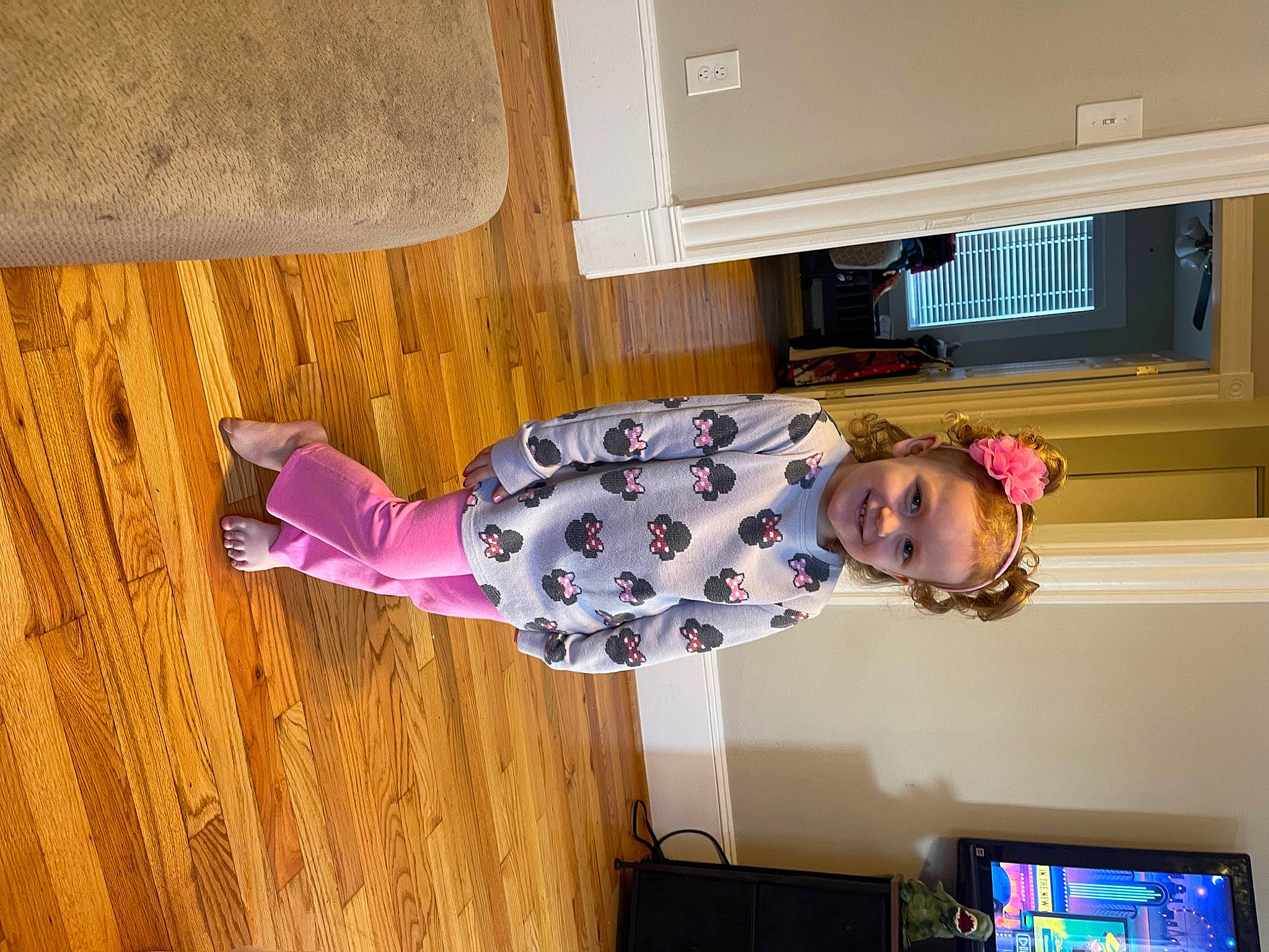 Kali joined the competition — help win amazing prizes! baby_toddler_clothing, cabinetry, child, display_device, flooring, fun, hardwood, home_appliance, joy, magenta, pattern, person, room, shelf, shelving, sleeve, smile, television, toddler, wood