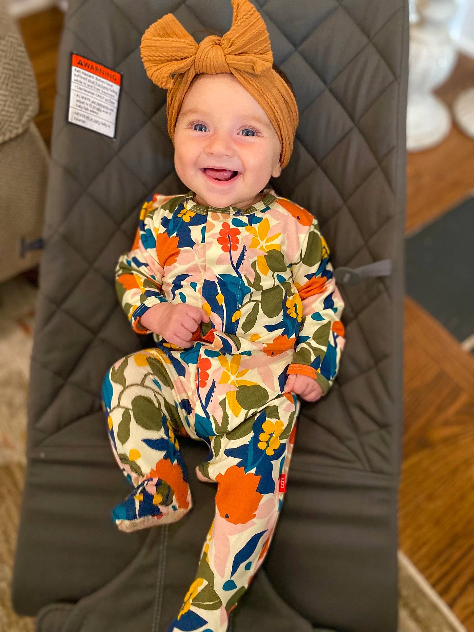 Aubree is registered to the contest to win money with this photo: baby, baby_toddler_clothing, cap, child, electric_blue, face, fun, hairstyle, happy, hat, head, headgear, headwear, joy, leg, orange, outerwear, person, sleeve, smile