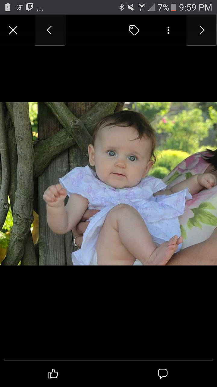 Cheyann is registered to the contest to win money with this photo: baby, baby_toddler_clothing, child, design, facial_expression, finger, flash_photography, font, gesture, grass, happy, person, photo_caption, plant, product, screenshot, sitting, skin, sleeve, toddler