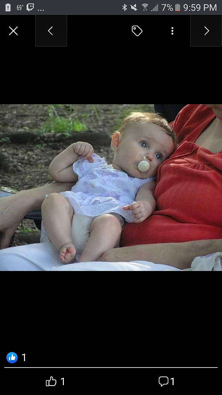 Cheyann is registered to the contest to win money with this photo: baby, baby_toddler_clothing, beauty, child, comfort, electronic_device, facial_expression, flash_photography, font, grass, happy, mammal, people, person, photo_caption, pink, product, screenshot, sitting, skin