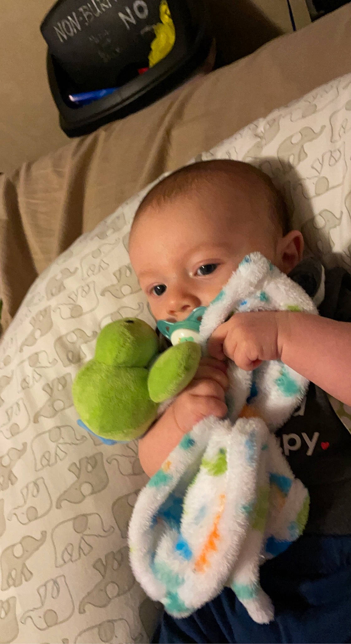 Kylar is registered to the contest to win money with this photo: arm, baby, baby_products, baby_safety, baby_toddler_clothing, cheek, child, comfort, finger, hand, infant_bed, iris, linens, mouth, nail, person, skin, stuffed_toy, thumb, toddler