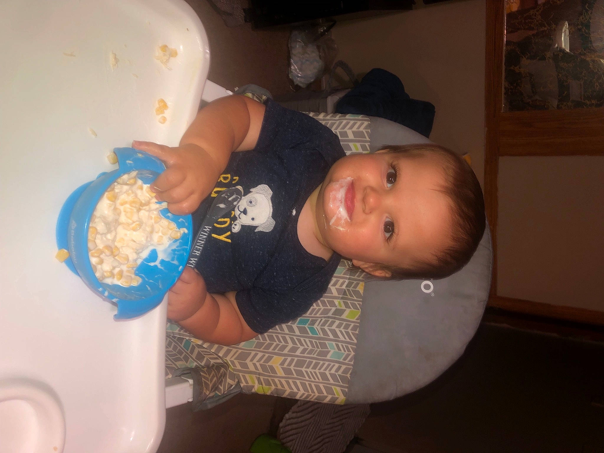 Gabe is registered to the contest to win money with this photo: baby, baby_toddler_clothing, child, finger, food, fun, hairstyle, hat, joy, person, picture_frame, plastic, product, room, smile, t_shirt, toddler