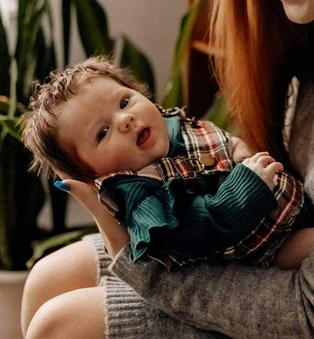 Matilda is registered to the contest to win money with this photo: baby, baby_toddler_clothing, blond, brown_hair, child, comfort, fur, grass, happy, joint, long_hair, pattern, person, plaid, shoulder, sitting, skin, sleeve, tartan, thigh