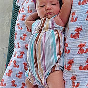 Aizley is registered to the contest to win money with this photo: arms, baby, blanket, bow, child, dress, face, feet, fox_pattern, headband, infant, legs, lying_down, newborn, outdoor, photography, play_mat, portrait, sleepy, striped_outfit
