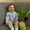 baby, child, smiling, sitting, couch, plant, green_pot, flower, indoor, milestone, 7_months, clothing, white_socks, happy, portrait, cute, young_child, home, decor, infant