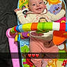 baby, blanket, bouncer, colorful, emoji_overlay, face, hands, happy, indoor, infant, legs, onesie, piano_toy, play_mat, portrait, remote_control, smiling, snapshot, socks, toy