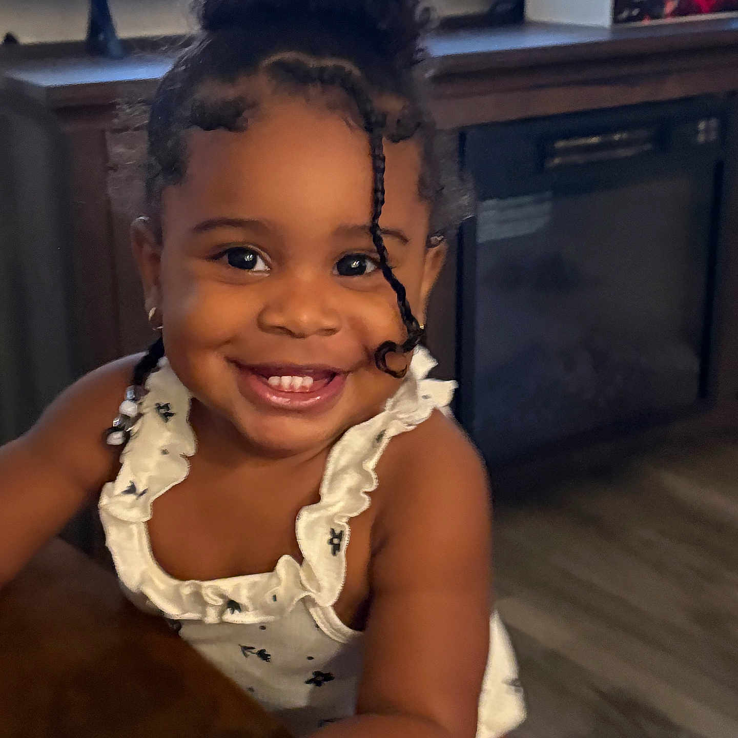 Lymaya joined the competition — help win amazing prizes! black_hair, child, closeup, curly_hair, cute, earrings, flooring, furniture, happy, indoor, living_room, person, portrait, railing, smile, table, television, toddler, white_clothing, young_child