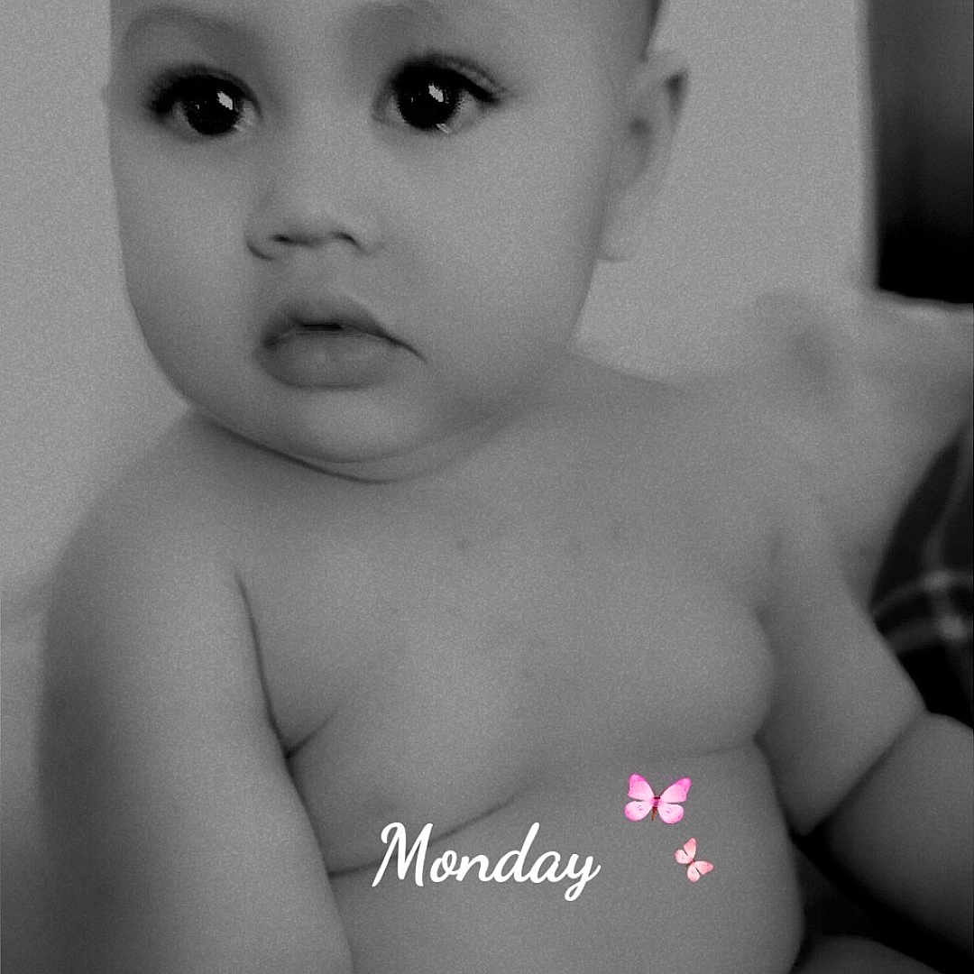 Katherine is registered to the contest to win money with this photo: baby, child, black_and_white, curly_hair, expression, face, infant, monochrome, naked_torso, pink_butterfly, portrait, sitting, soft_light, text_overlay, word_monday, young_child, cute, chubby, indoors, skin