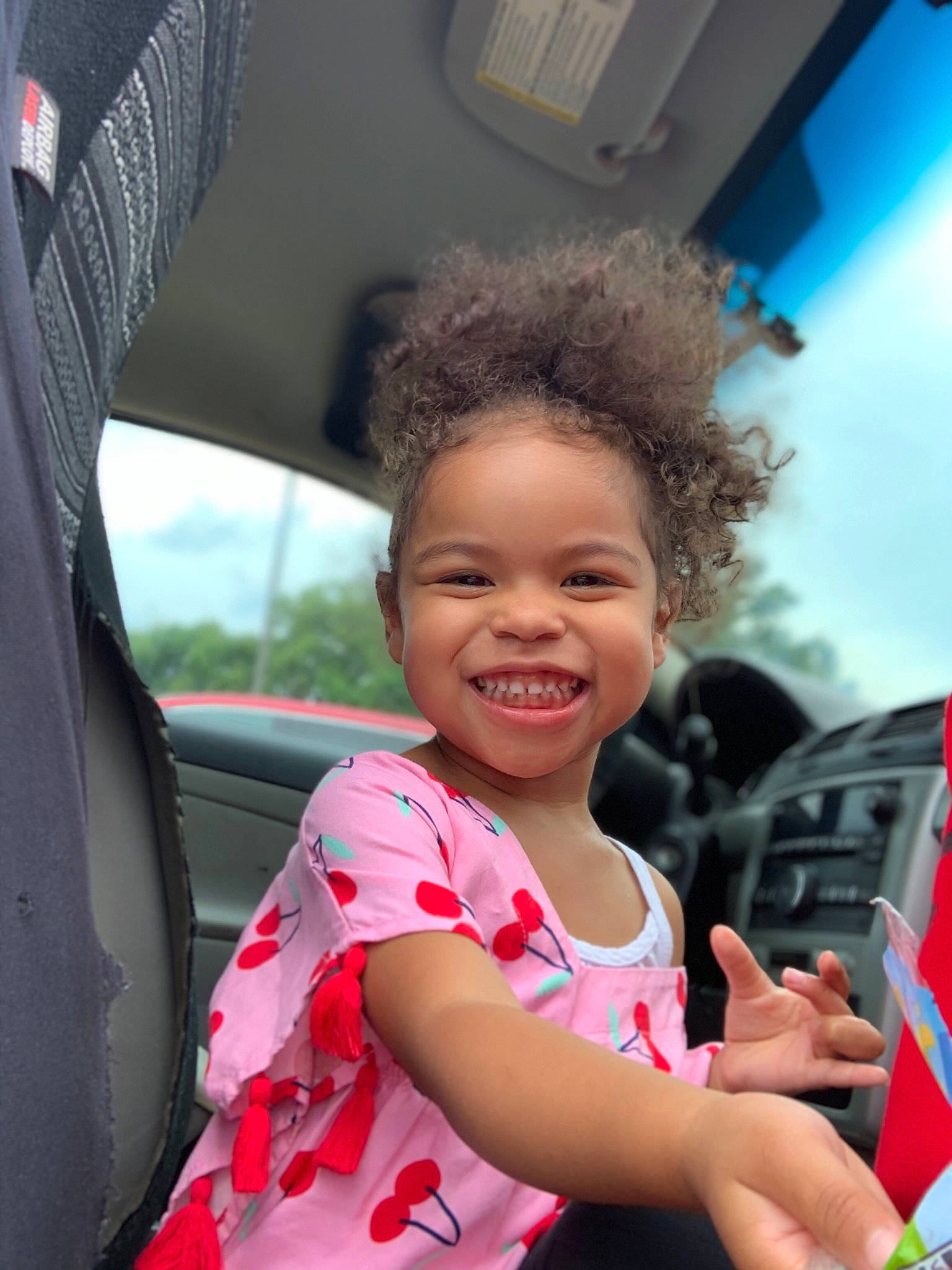 Clover joined the competition — help win amazing prizes! car, car_seat, child, family_car, fun, gesture, happy, joy, leisure, person, pink, smile, toddler, vacation, vehicle